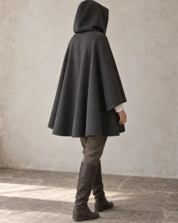 Rear view of the Ashvale Short Wool Cape showing its clean mid-thigh drape