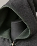 Close-up of the Bellamy Two-Tone Wool Hood showing the charcoal outer face and green inner face