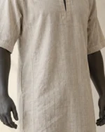 Close-up of the Bram Short-Sleeve Linen Tunic showing the rounded keyhole neckline and plain front