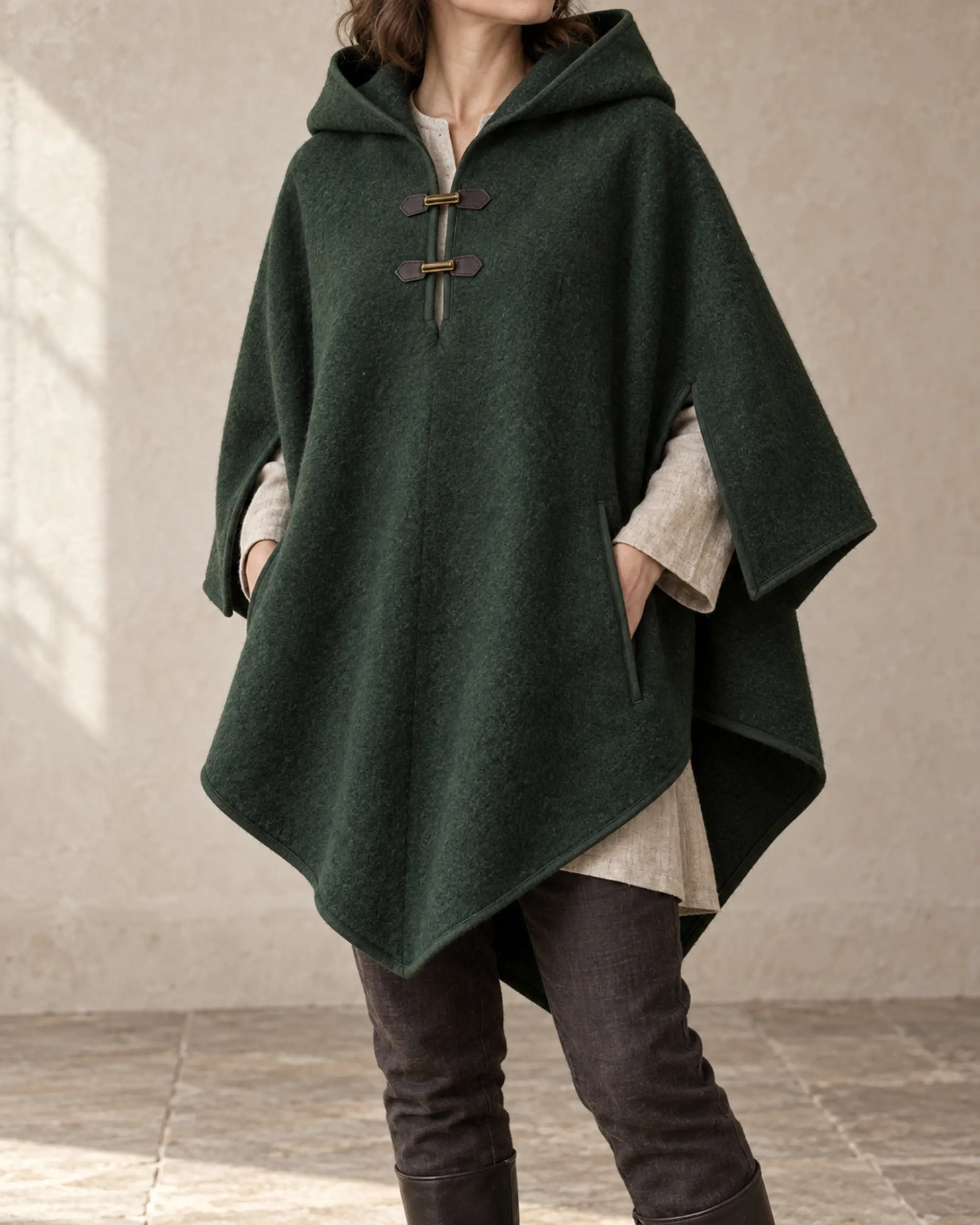 moorland-hooded-wool-poncho-forest-green-front Moorland Hooded Wool Poncho in forest green with a pointed drape and two throat tabs