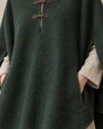 Close-up of the Moorland Hooded Wool Poncho showing the front opening and throat tabs