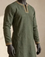 Close-up of the Soren Embroidered Linen Tunic showing the embroidered neckline and cuff trim