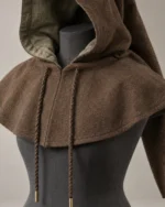 Close-up of the Warden Travel Hood showing the face opening, mantle and braided cords