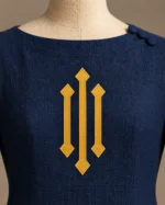 Aveline Heraldic Bell-Sleeve Tunic in Navy and Gold, detail view