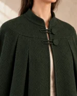 Rowanhall Box-Pleated Wool Cloak in Forest Green, close-up of collar, cloth and closure construction